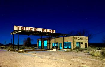 picture of a truck stop at night